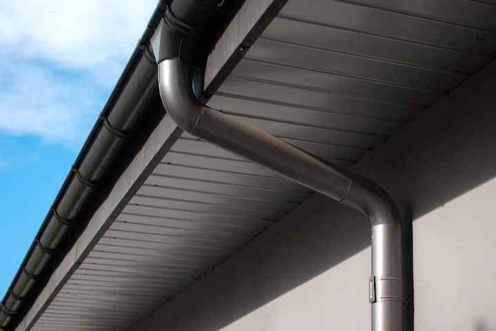 Corrosion-resistant galvanized gutters installed on a commercial building in Virginia Beach